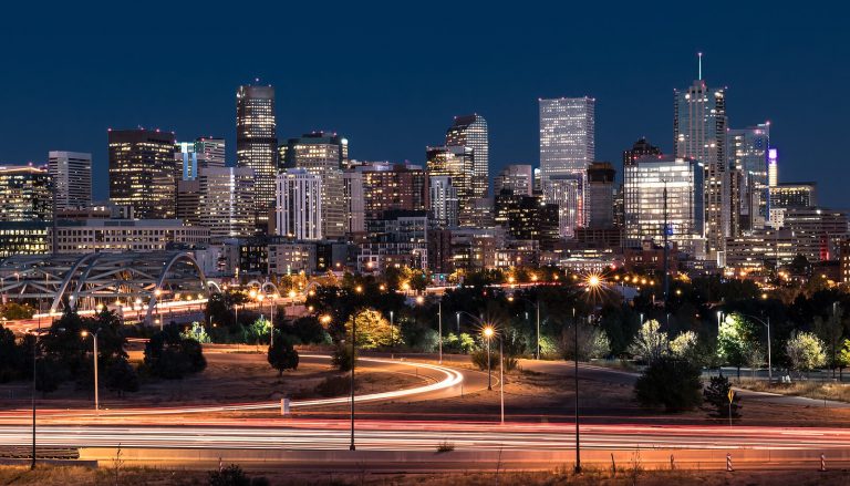 The Denver skyline shines brightly at dusk, with glowing city lights reflecting a vibrant community. This image reflects the growing demand for services like ADHD testing in Denver and access to a skilled therapist in Hampden, CO. Whether you’re exploring in-person sessions or online therapy in Denver, CO, support is closer than you think.