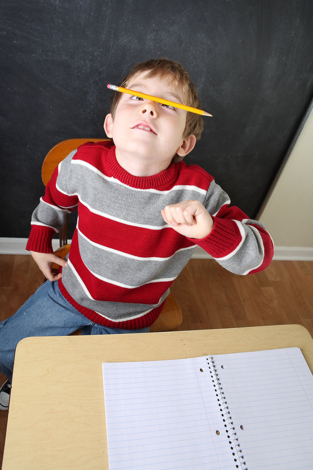 Playful, fidgety student during lesson—an example that can prompt adhd testing in Englewood, CO, adhd testing in Littleton, CO, adhd testing in Greenwood Village, CO, and ongoing child therapy in Englewood, CO. 