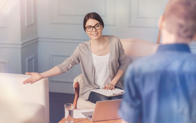 Therapist meeting with a client in a calm office, offering supportive guidance after an adult autism diagnosis denver. This image reflects the kind of care people may seek during an autism evaluation denver with an autism therapist in greenwood village, co.