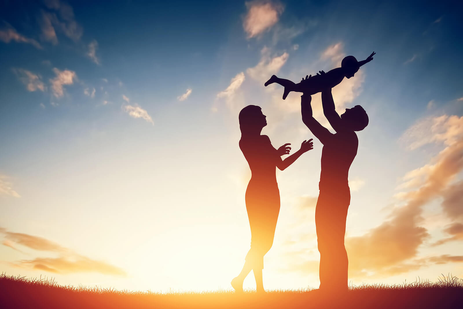 family playing outside | adhd therapist for adults in colorado | adhd therapy for adults in englewood, co | adhd therapist for adults in englewood, co | denver, co | greenwood village, co | englewood, co A silhouette of two parents joyfully lifting their young child into the air against a warm sunset sky, capturing the deep love and playful connection that ADHD parents bring to their families. With the right support from an ADHD therapist for adults in Englewood, CO or an ADHD therapist for adults in Colorado, parents can move from shame and overwhelm toward confidence and intentional connection. This kind of hopeful, thriving family life is exactly what ADHD therapy works toward.